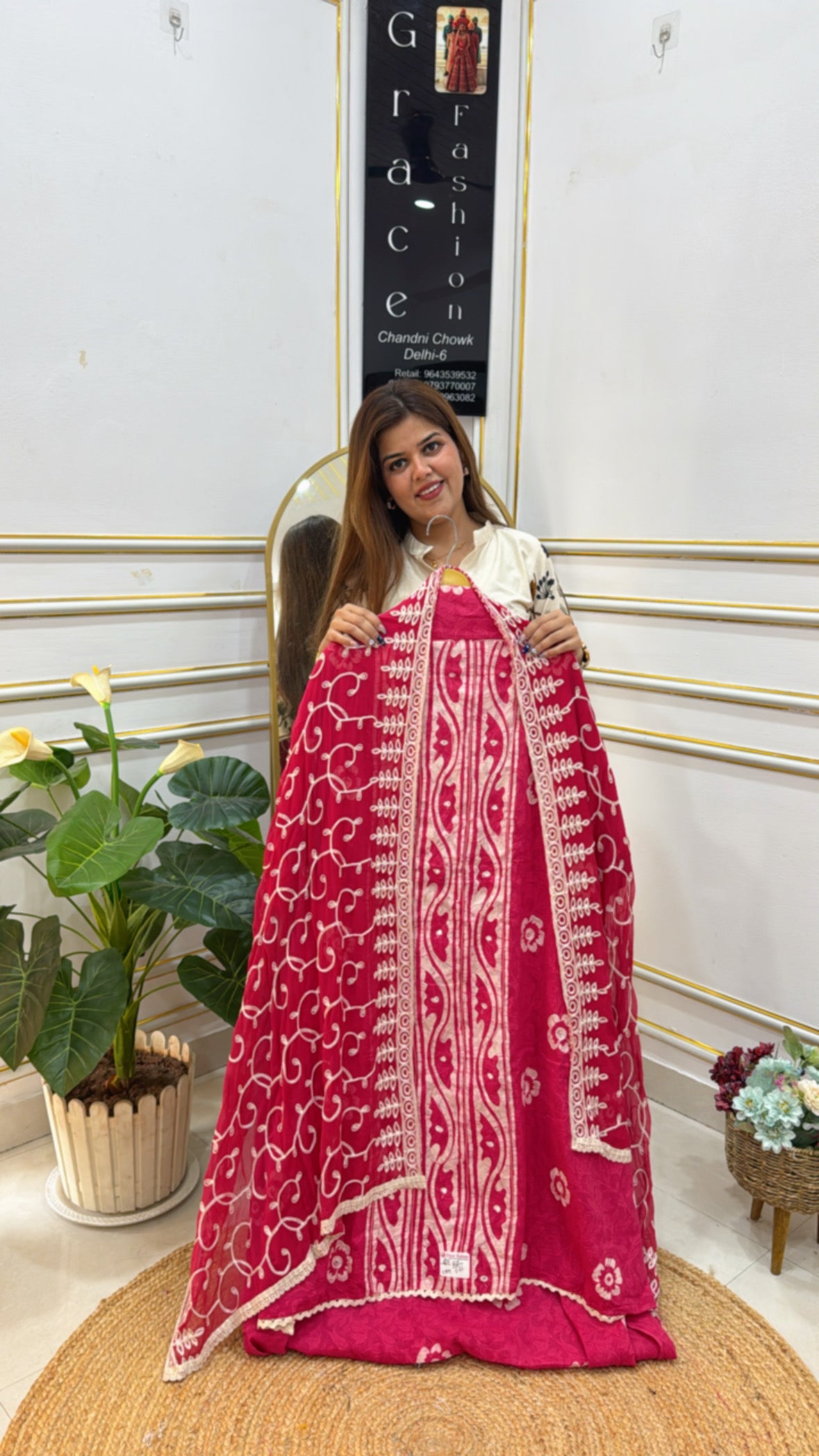 Elegant unstitched cotton suit set in vibrant pink with traditional embroidery and lace detailing