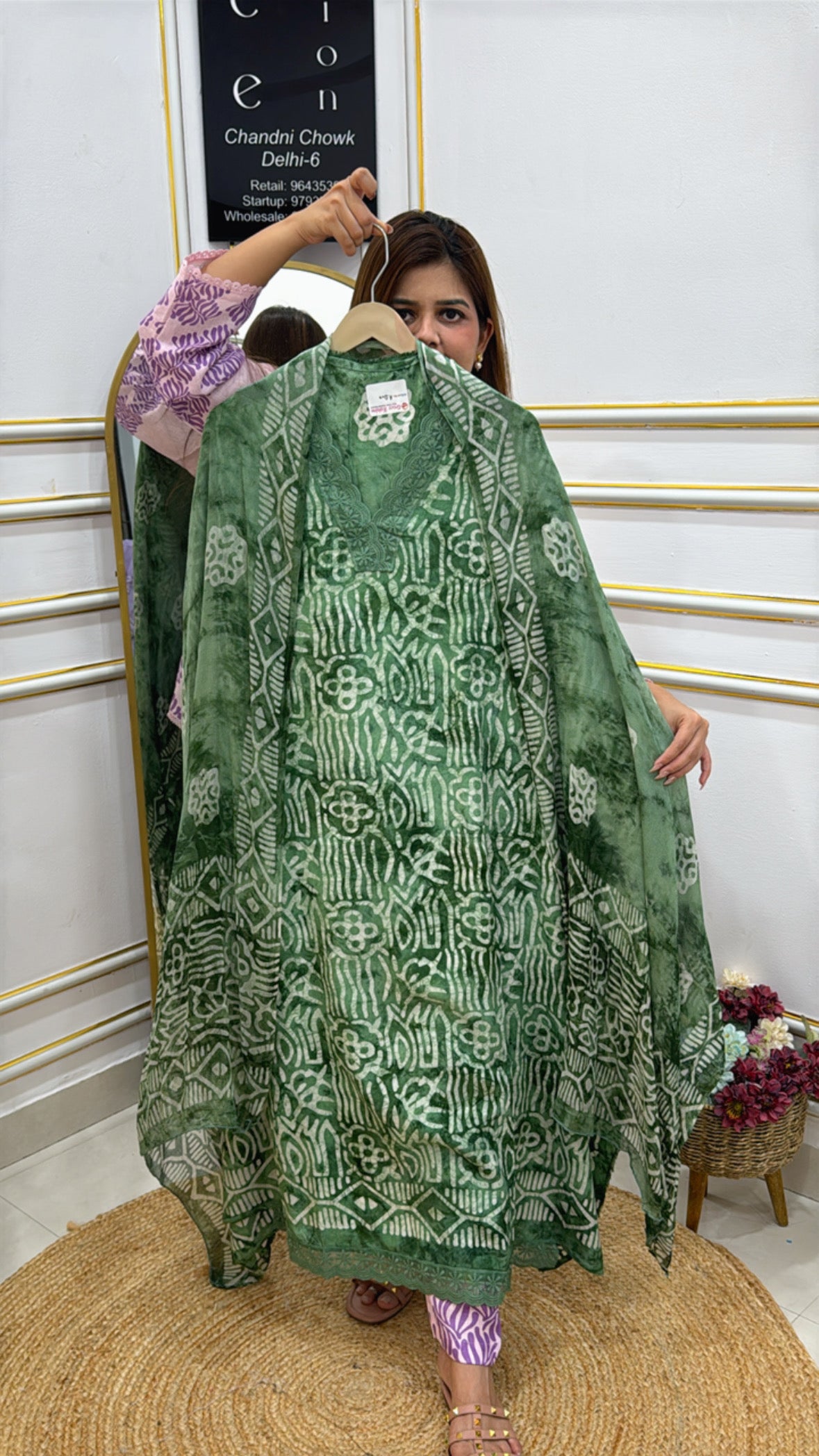 Elegant green Cotton Maheshwari batik fabric shawl showcasing intricate patterns and a flowing design