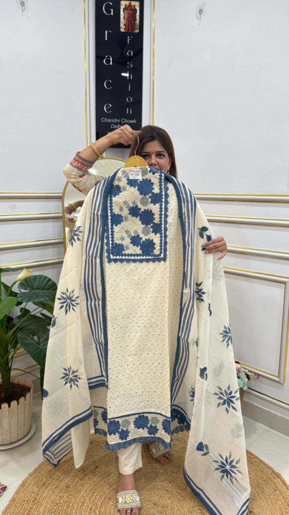 Elegant unstitched ladies suits online in cream with blue floral designs, perfect for festive wear