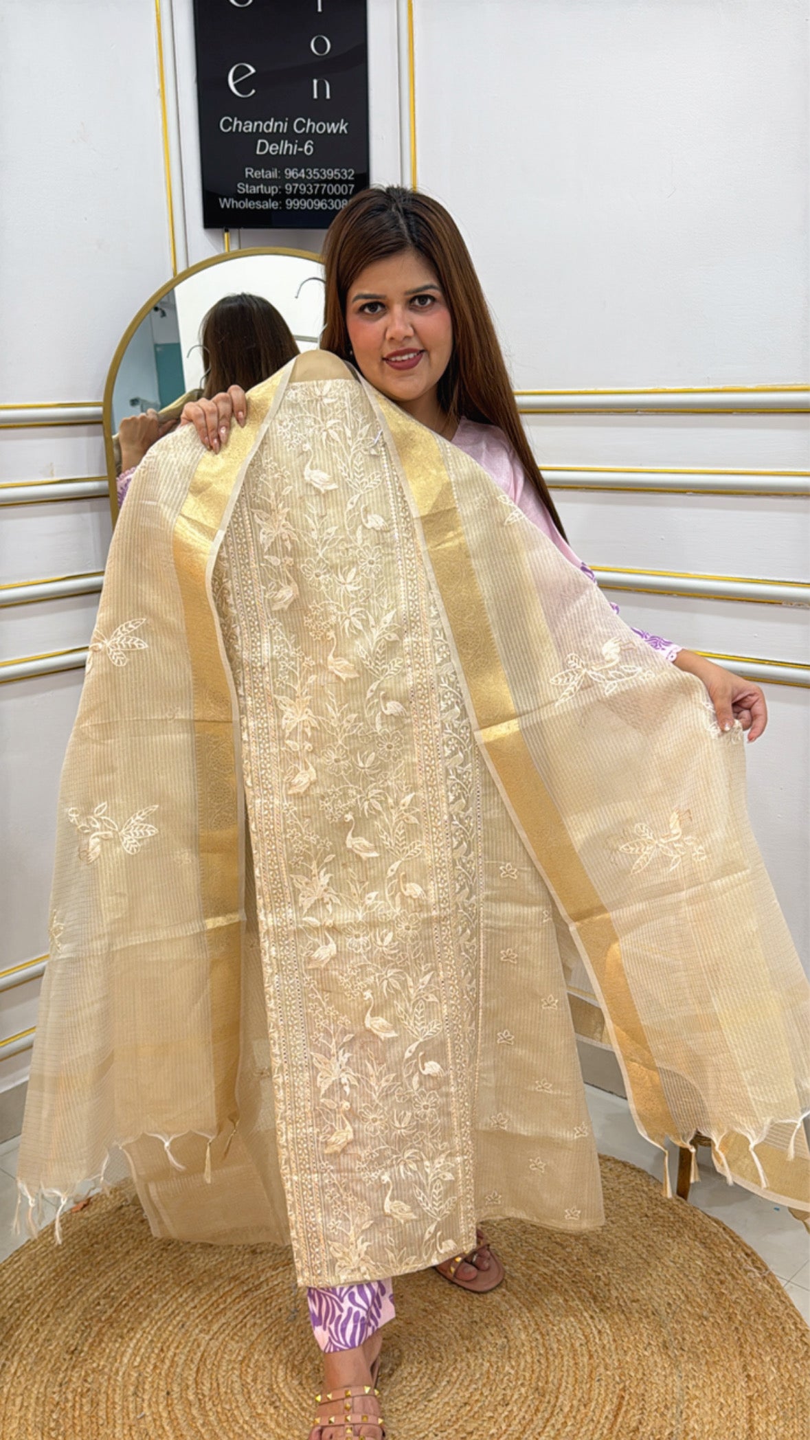 Model showcasing a stylish Flamingo Shimmer Suit Unstitched with intricate embroidery details