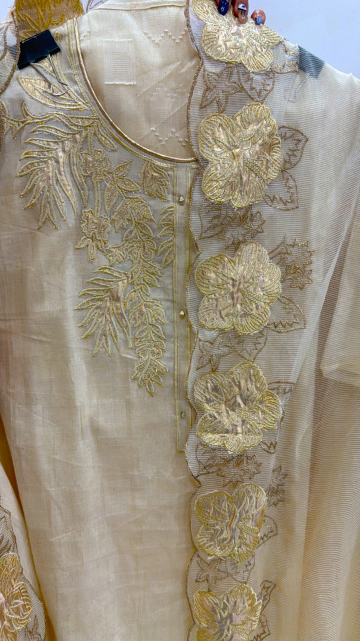 KORA cotton applique suit in cream color with intricate floral embroidery detailing on the front