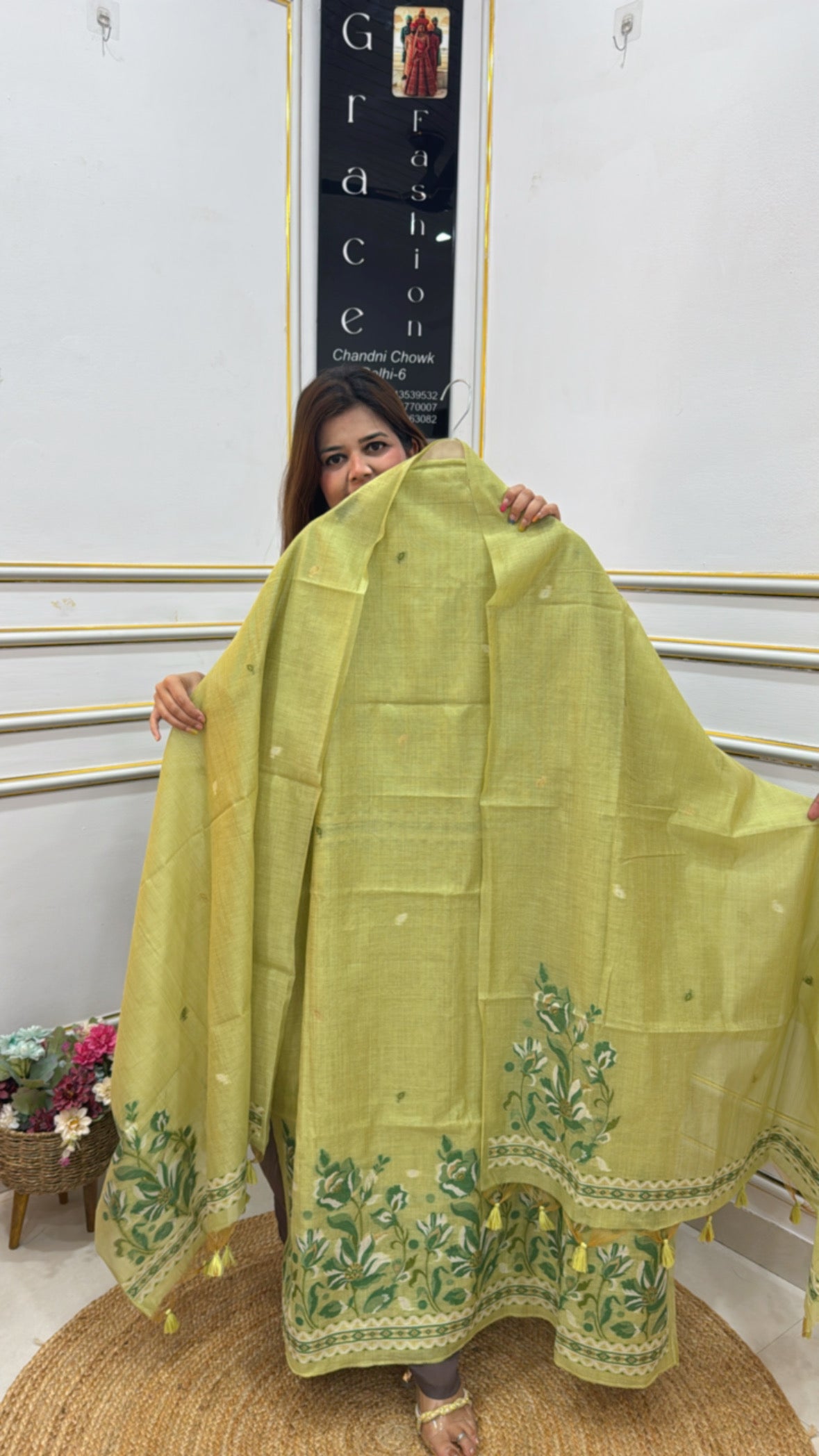 Linen Jamdhani semi party wear suit in vibrant yellow with intricate floral embroidery and tassels