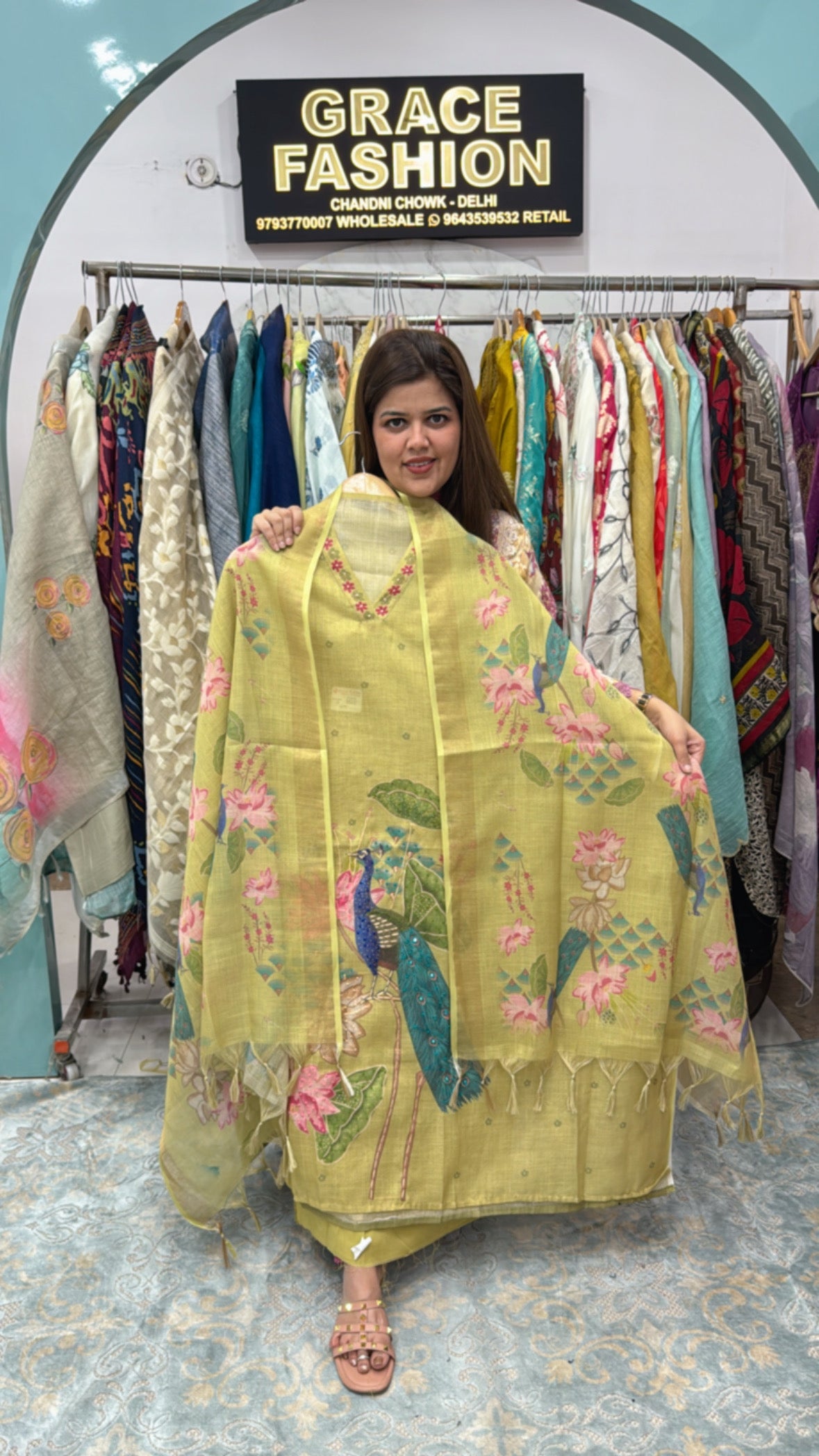 Model showcasing a stylish linen semi party wear suit in light yellow with floral patterns