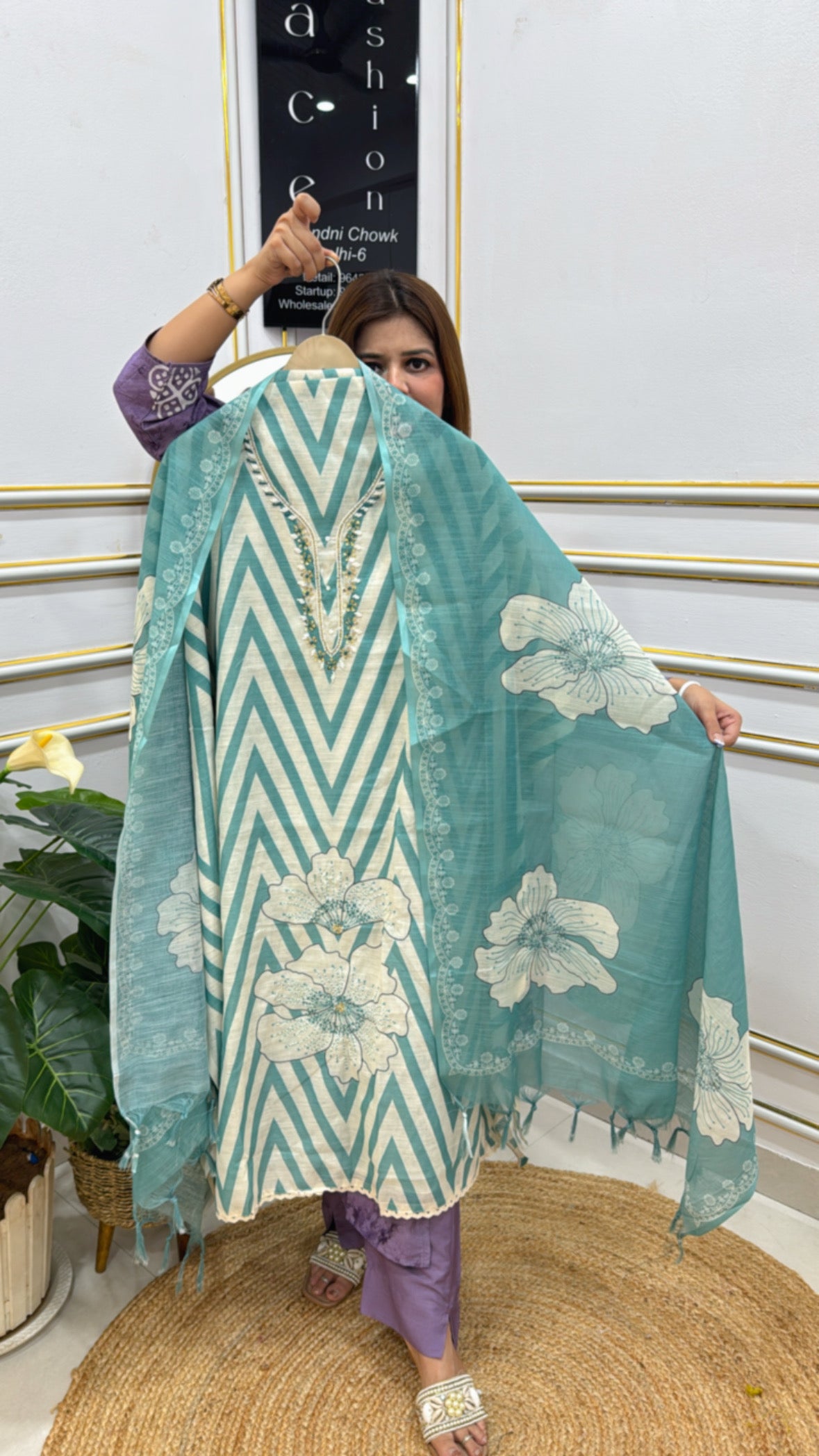 Light turquoise linen shirt fabric unstitched with floral design and chevron pattern for elegant outfits