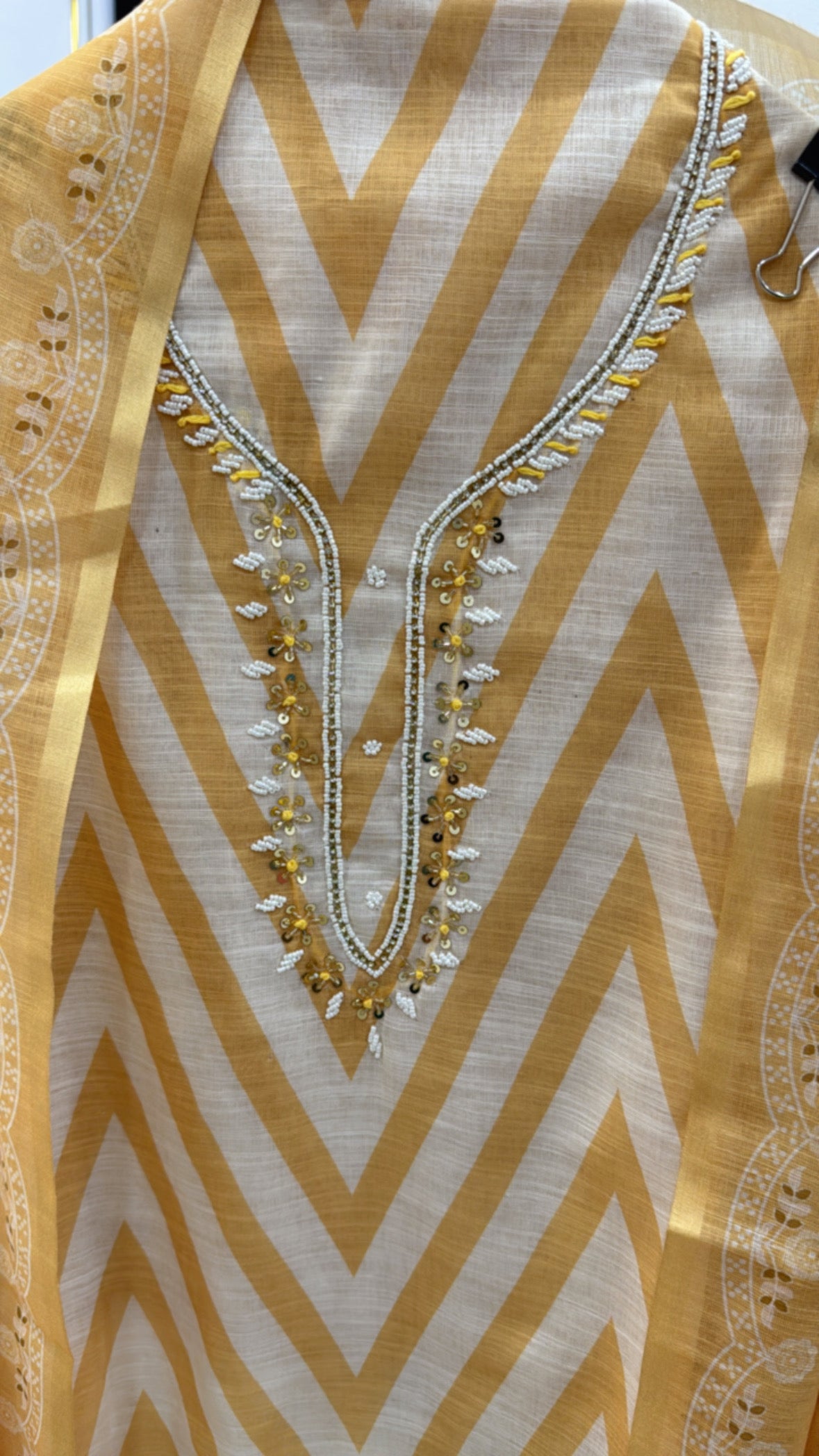 Yellow and white linen shirt fabric unstitched with chevron pattern and intricate neckline detailing