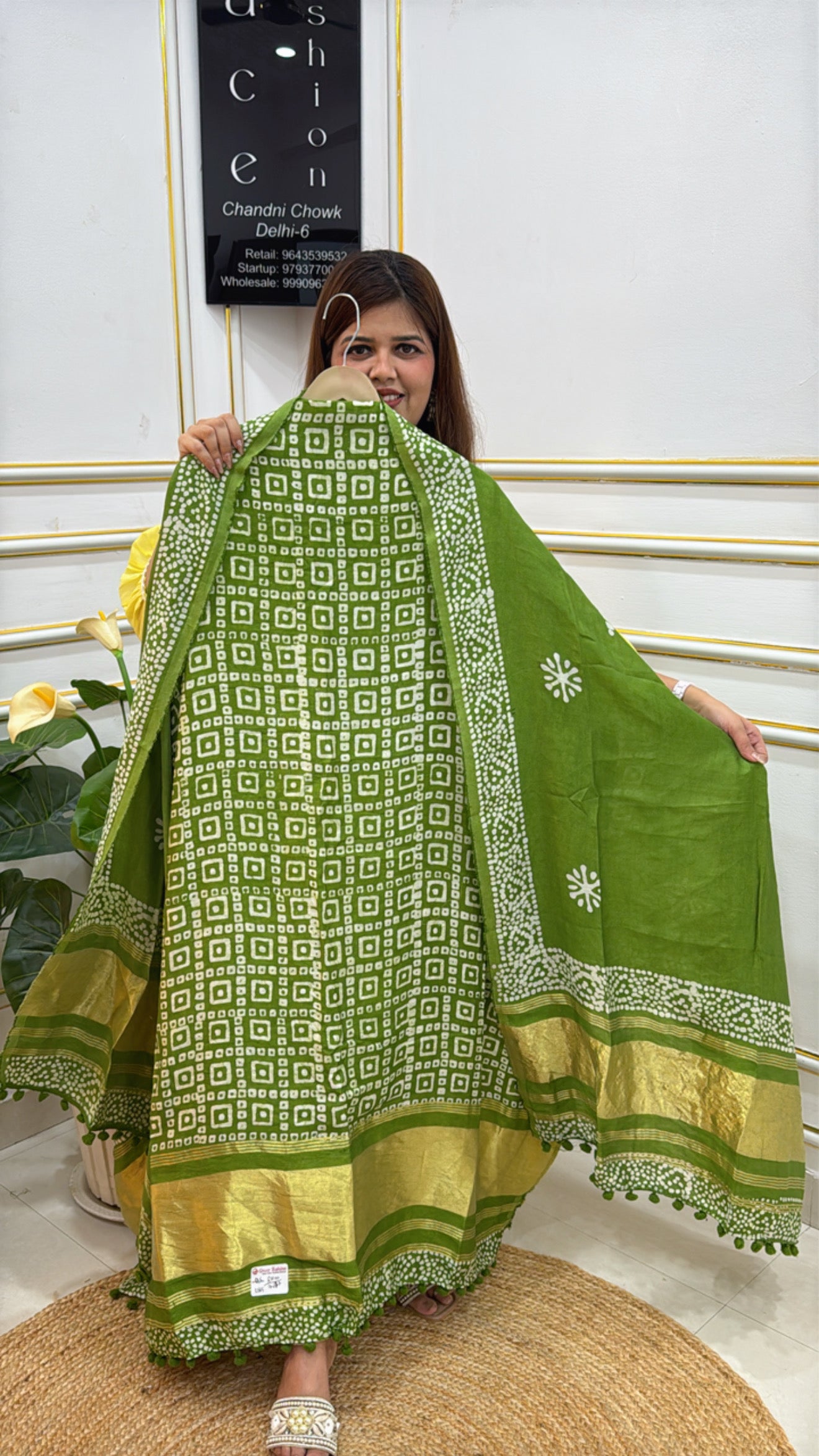 Elegant green premium batik suits with intricate patterns and gold accents, perfect for festive occasions