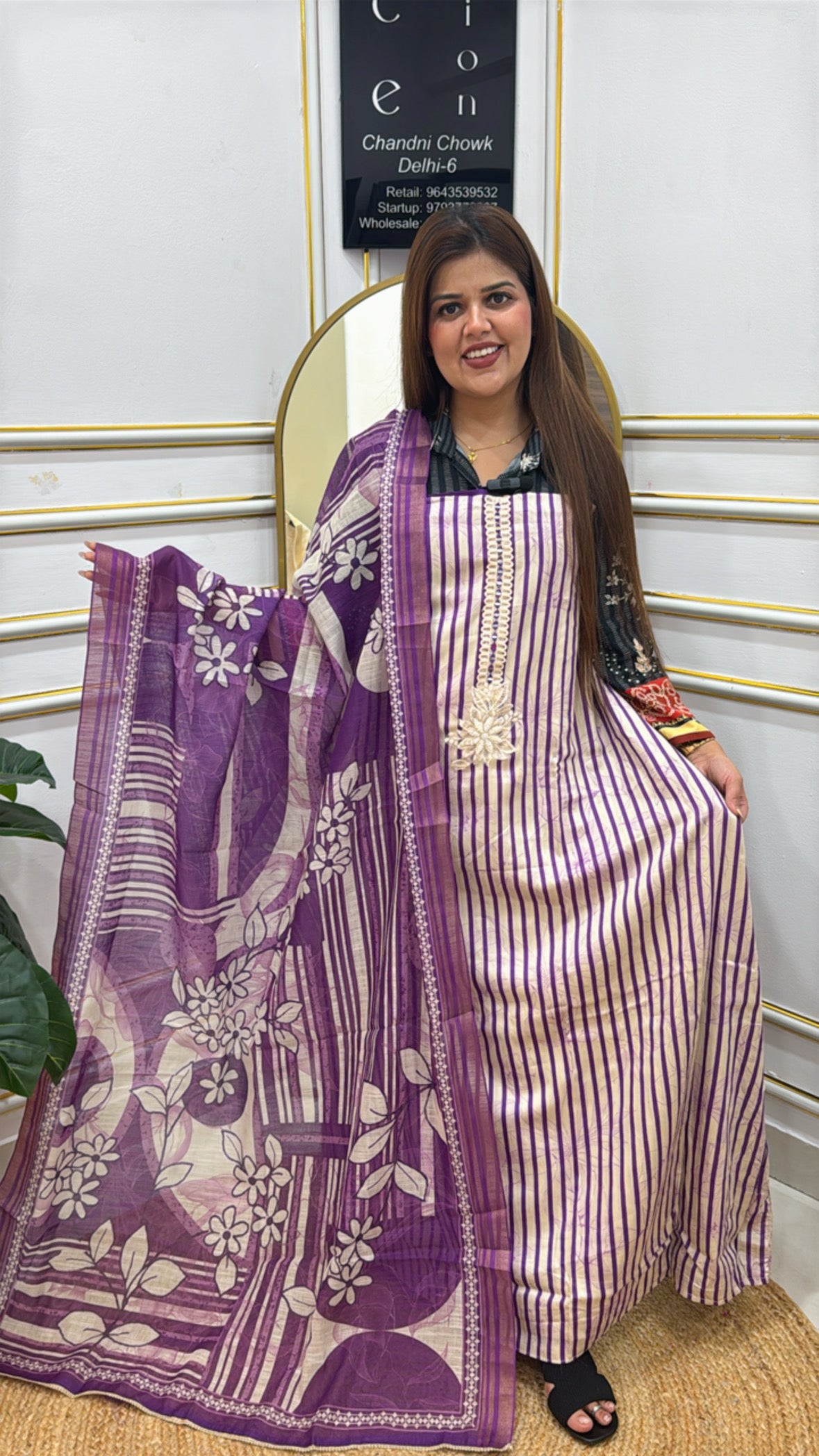 Elegant model wearing a premium cotton shirt with pearl details, complemented by a stylish shawl