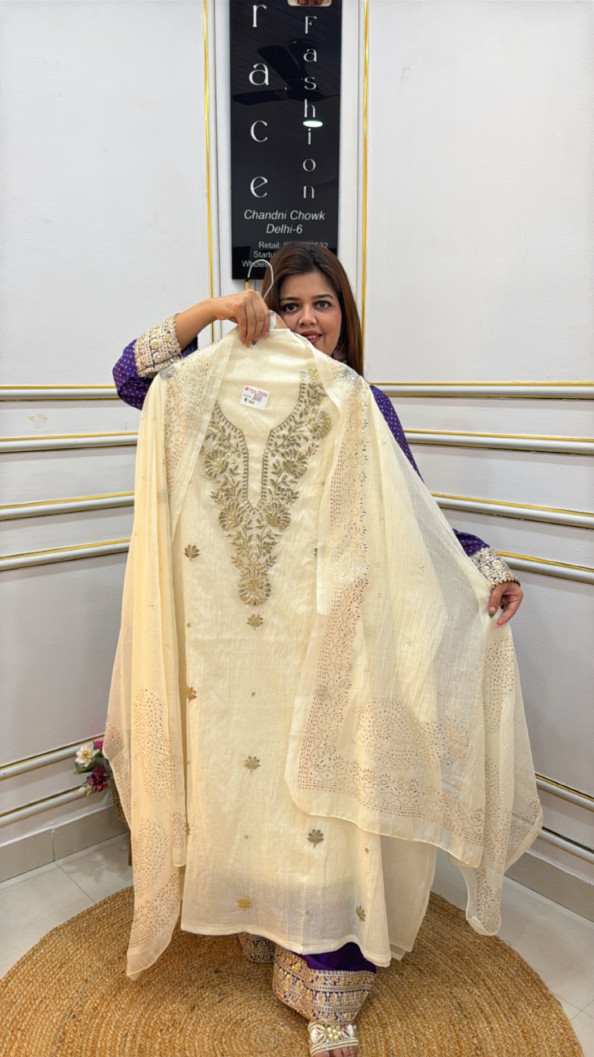 Elegant churidar suit in off-white with intricate embroidery made from premium cotton silk fabric