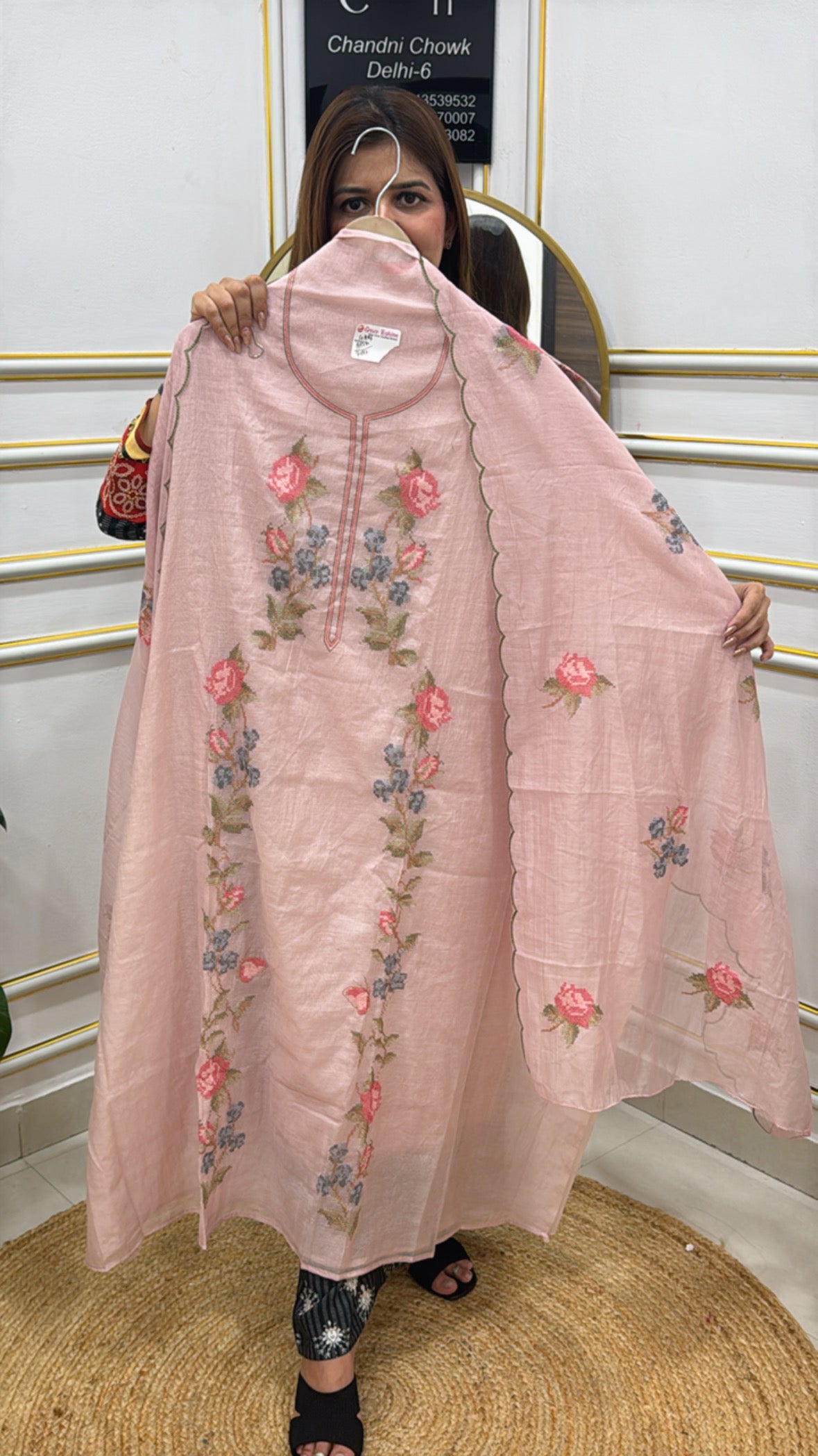 Elegant dress in light pink with floral embroidery made from premium cotton silk fabric
