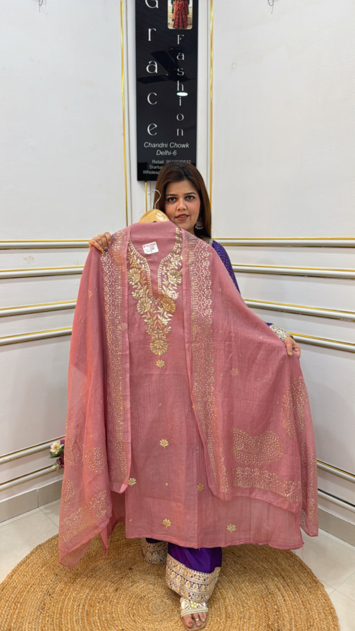 Elegant pink outfit made from premium cotton silk fabric featuring intricate embroidery and details
