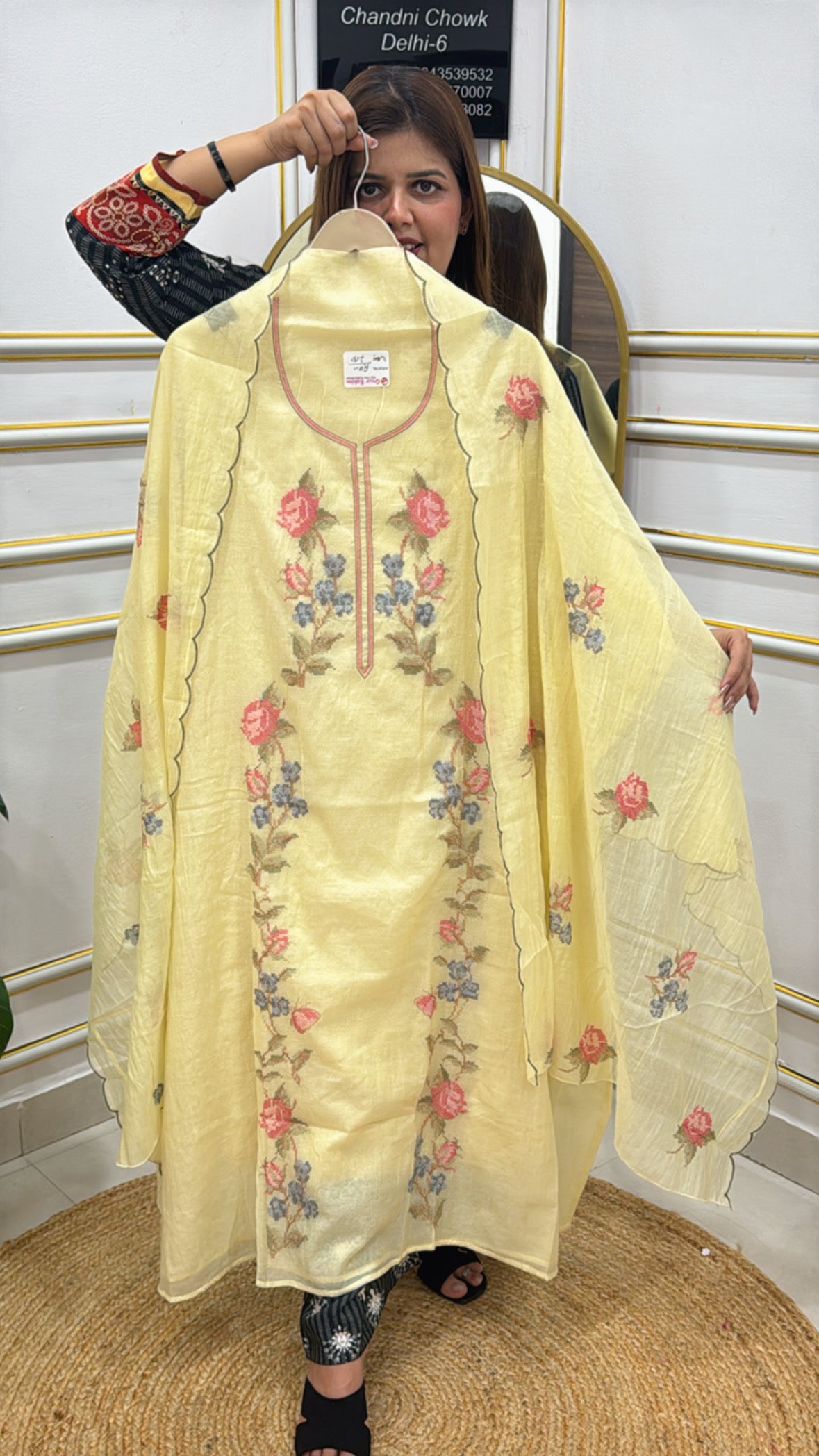 Elegant yellow long kurta set made from premium cotton silk fabric with floral embroidery details