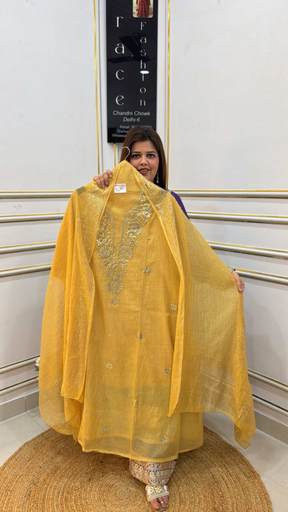 Elegant yellow outfit made from premium cotton silk fabric with intricate embroidery details