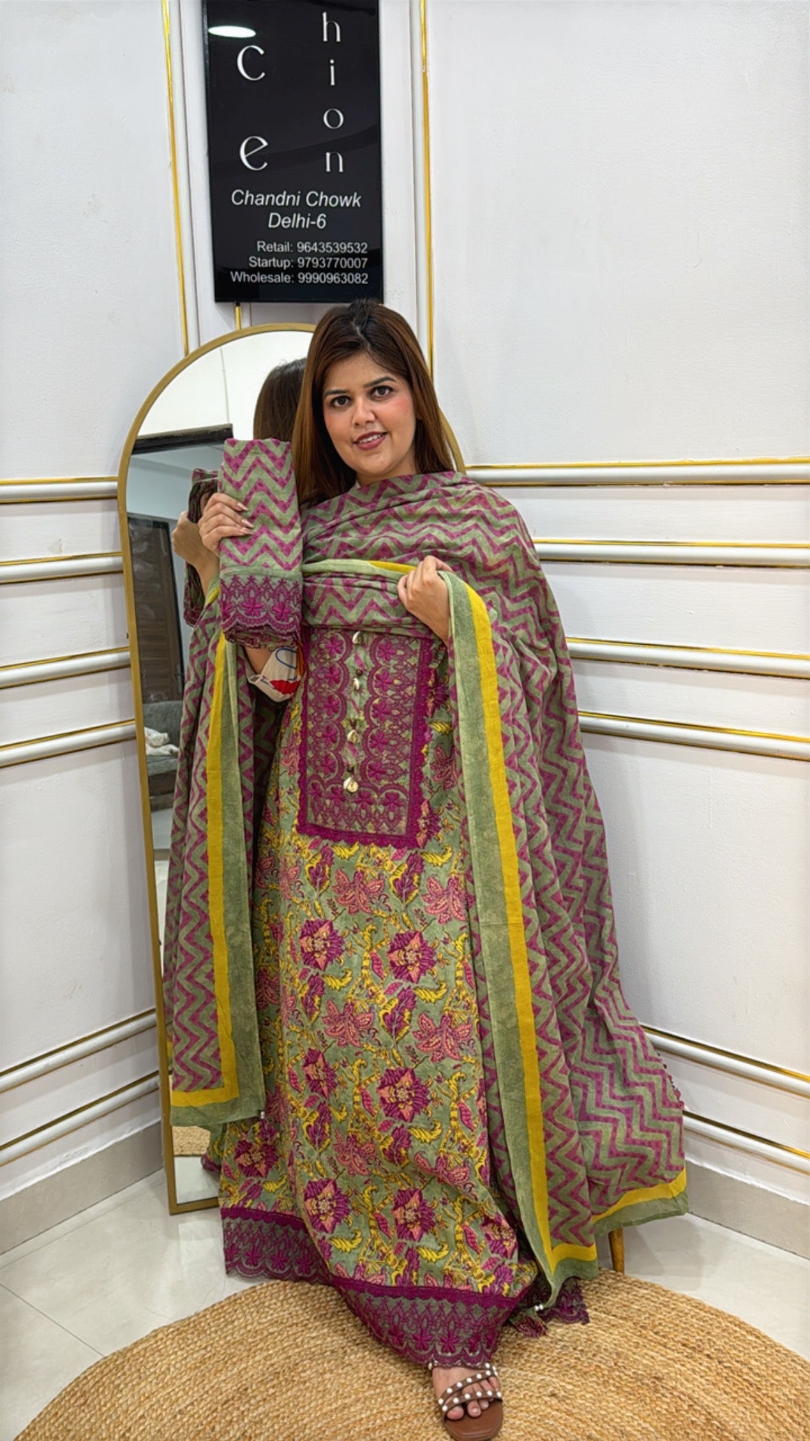 Elegant model showcasing premium cotton unstitched suits in vibrant floral patterns and a chic dupatta