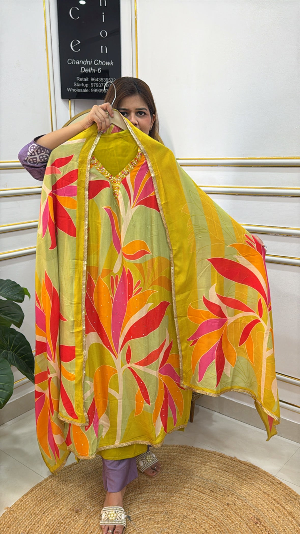Elegant premium muslin suits for women featuring vibrant floral prints in yellow and pink shades