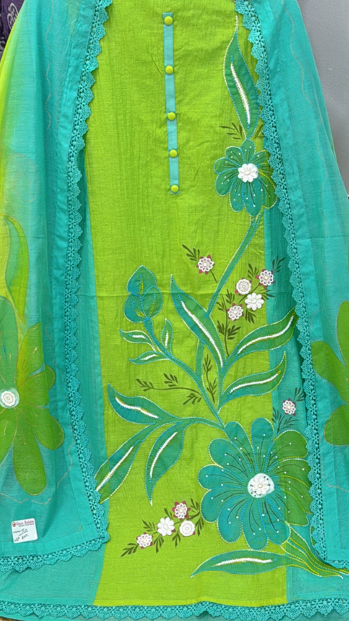Premium neonish cotton suits featuring floral embroidery in vibrant green and turquoise colors
