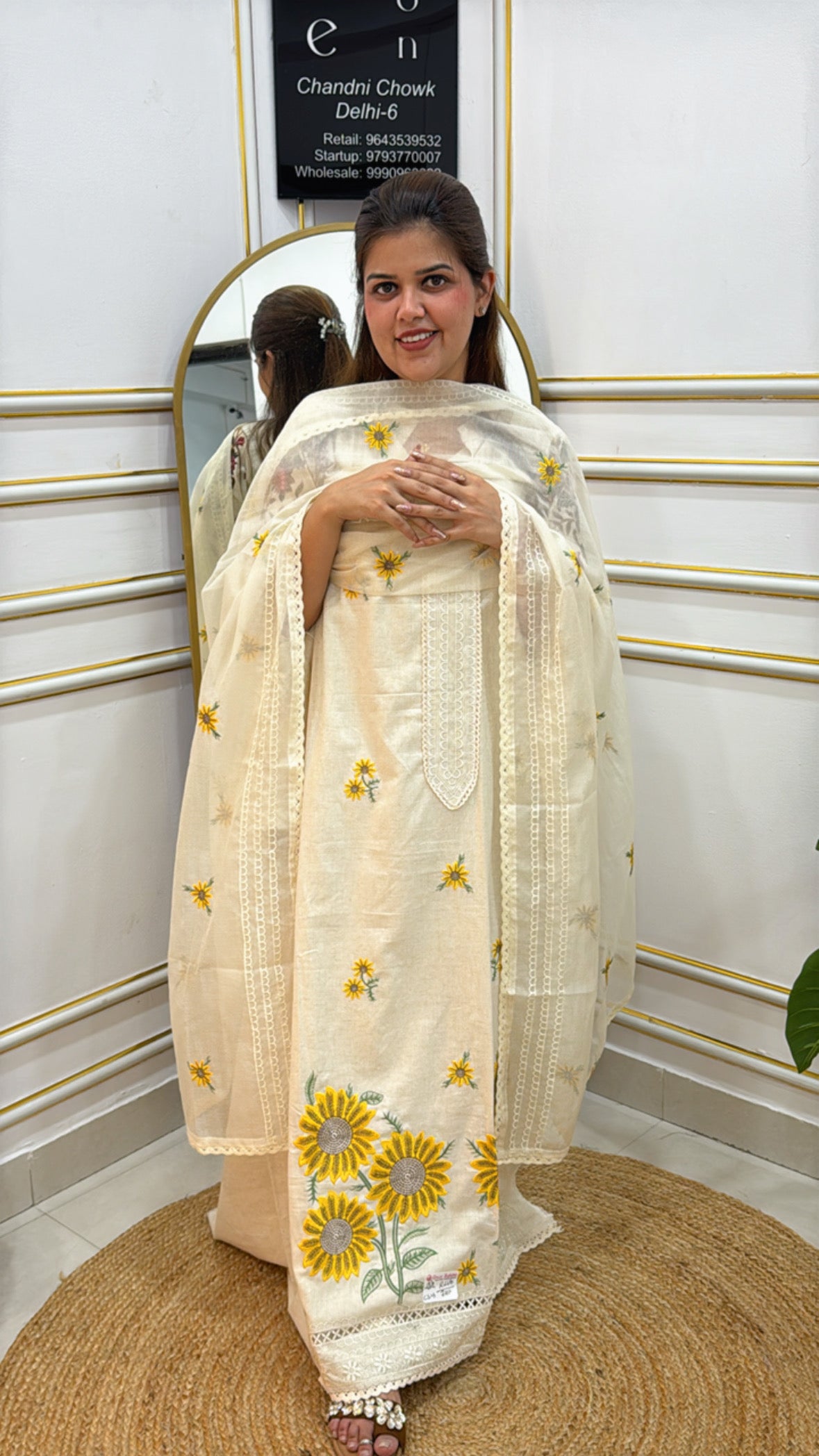 Elegant cream-colored anarkali suit with floral embroidery by The Grace Fashion, perfect for special occasions