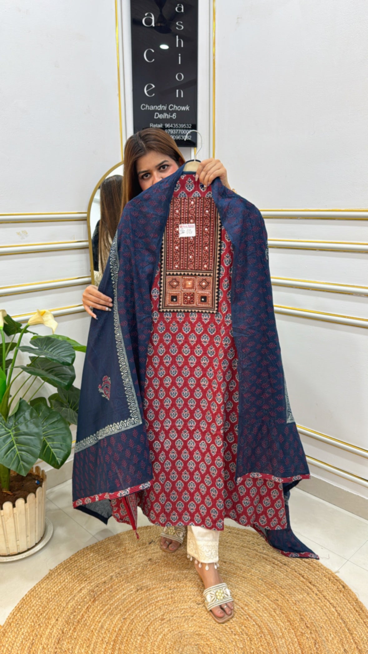 Traditional Cotton Suit Set in red and navy with intricate patterns and matching dupatta displayed by model