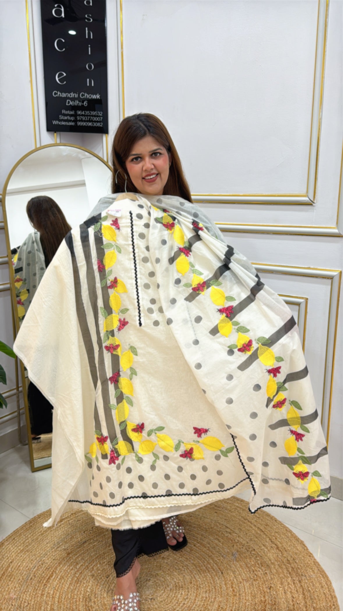 Elegant floral print cape from The Grace Fashion featuring bold colors and a unique design