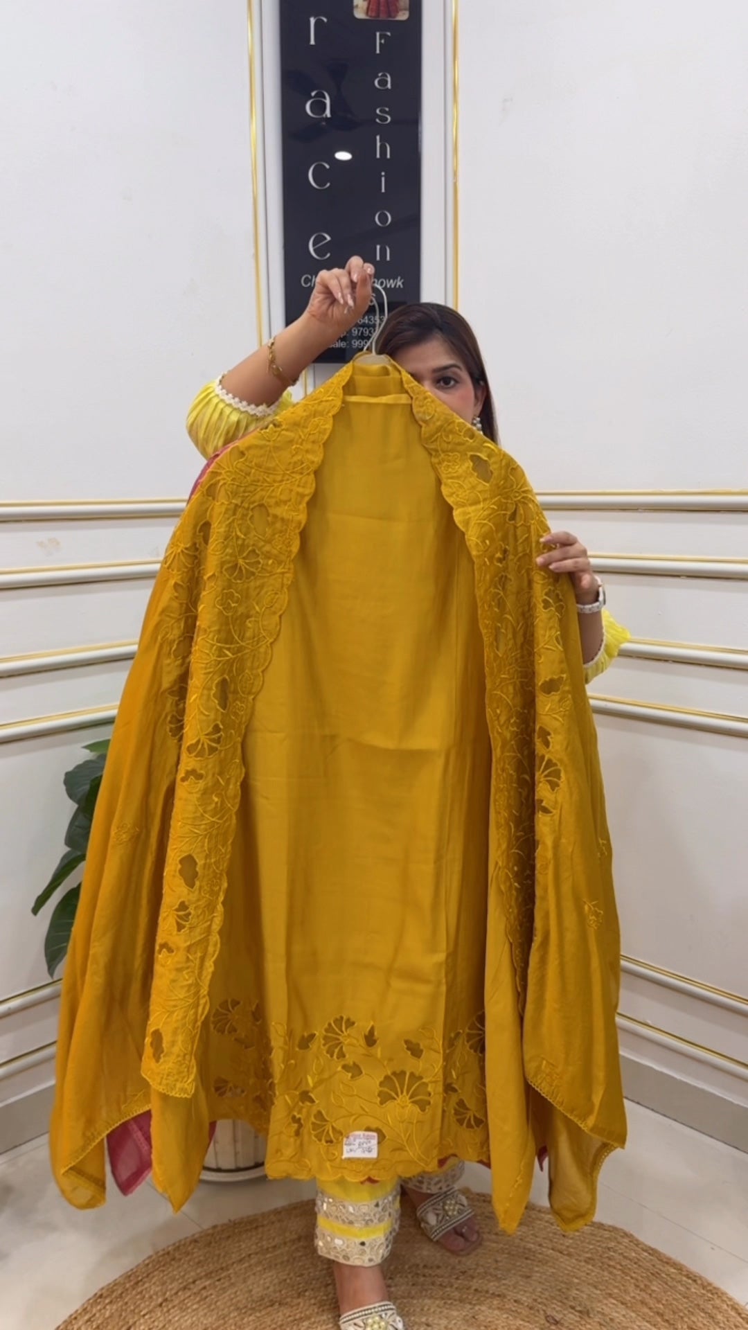Elegant mustard yellow shawl from The Grace Fashion featuring intricate floral embroidery
