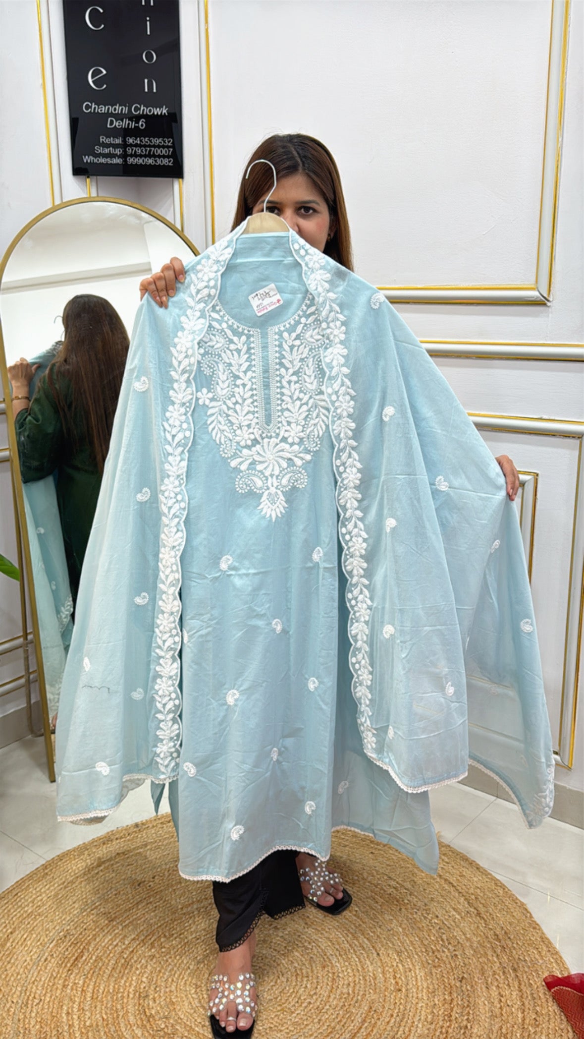 Elegant light blue embroidered cape with floral details perfect for festive occasions