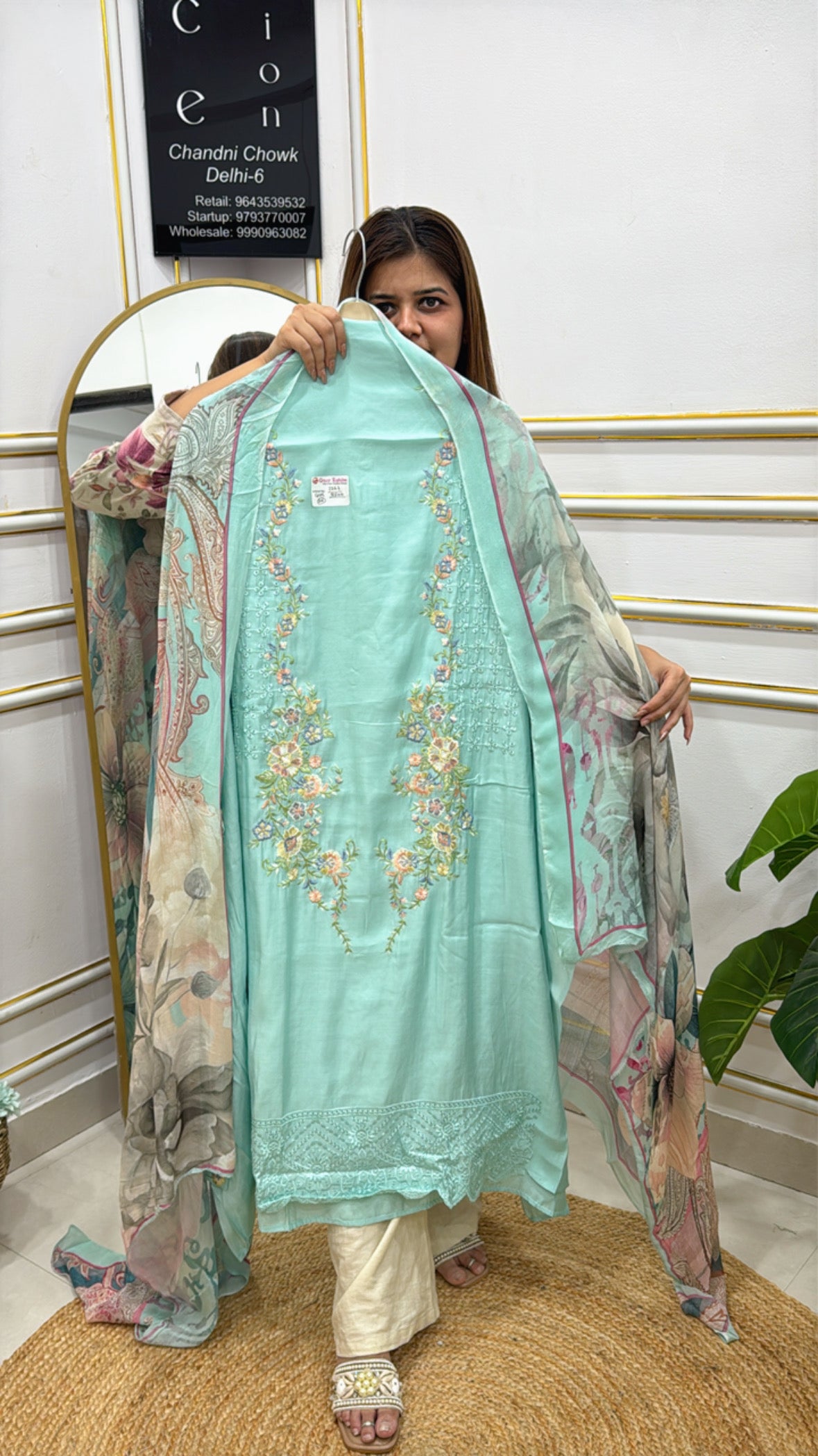Model showcasing light blue embroidered kurta with floral printed dupatta from The Grace Fashion
